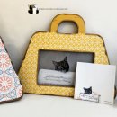 가방위에 고양이 이미지