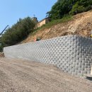 (유)제이엔보강토 | 고흥 축정지구: 천공 및 강봉 체결로 완성한 절토부 보강토 옹벽